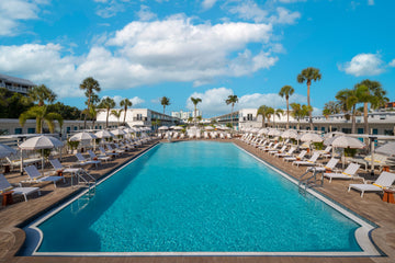 The Luce pool deck with cabanas and loungers overlooking St. Pete Beach
