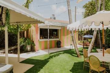 Upper Eastside Hangout's coral-and-green Original Bar Shack with patio awnings in Little River, Miami