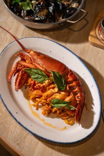 Athenian lobster pasta with handmade linguine and cherry tomato sauce at Manoli in Coconut Grove, Miami