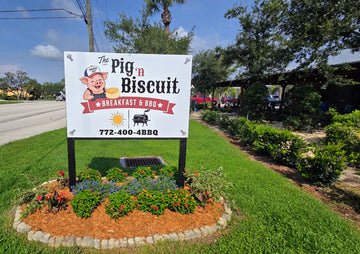 The Pig 'n Biscuit sign at the new outdoor BBQ and biscuit kitchen inside the CW Willis Family Farms garden center in Vero Beach, Florida